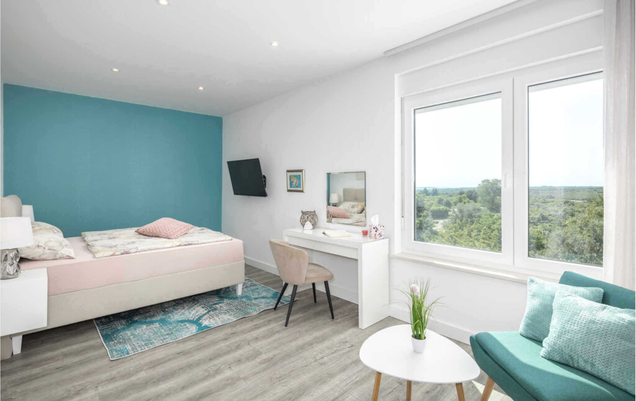 Bright bedroom with desk and garden view