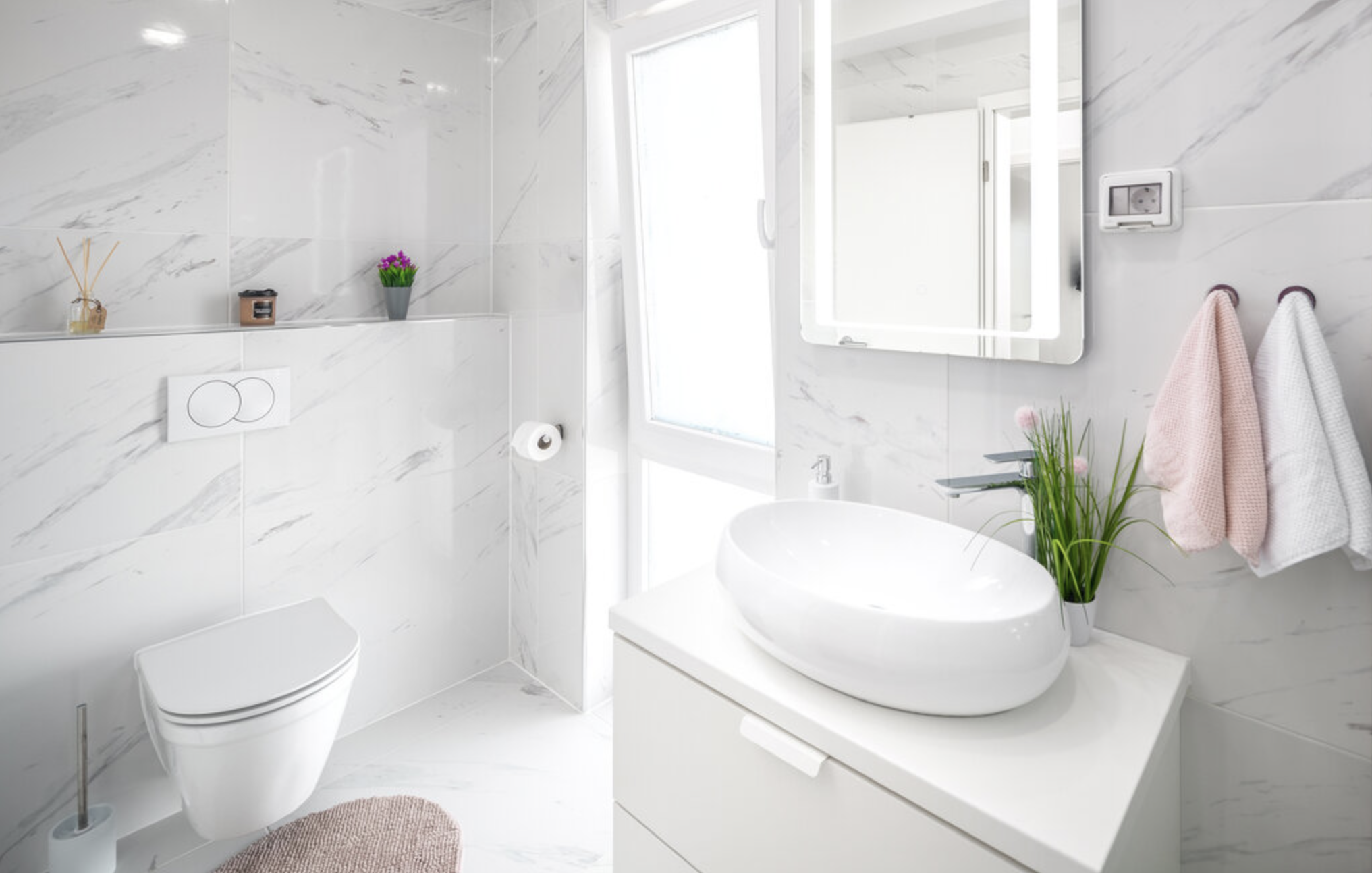 Bright bathroom vanity and fixtures at Villa Mia